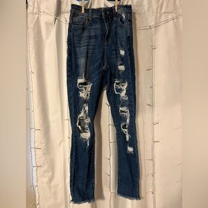 Dark wash skinny jeans with holes